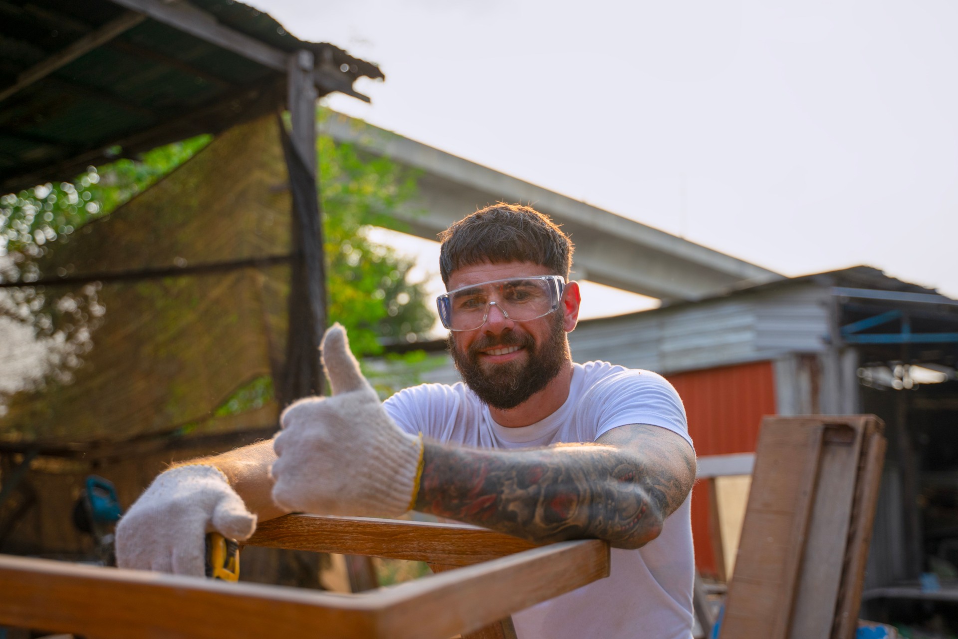 Carpenter is working at workshop.
